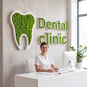 May include: A dental clinic reception area featuring a large, white-framed wall sign shaped like a tooth filled with vibrant green moss. The words Dental clinic are displayed in white-framed, moss-filled lettering on the textured wall.