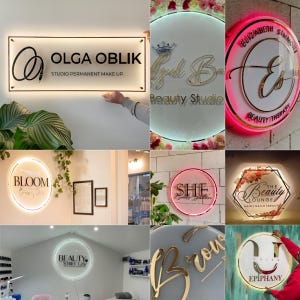 May include: Collection of illuminated business signs with various designs and text. Signs include "OLGA OBLIK", "Bloom", "Elizabeth Simmons", "She Nails Salon", "The Beauty Lounge", "Beauty Studio", "Beauty Studio", and "Urban Epiphany". The signs are in different shapes and colors.