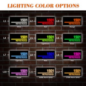 May include: A display of illuminated address signs with various color options: white, red, orange, yellow, light green, green, light blue, blue, pink, purple, and warm white. Each sign displays the number 1501 and "NE First Avenue". The text "LIGHTING COLOR OPTIONS" is at the top.