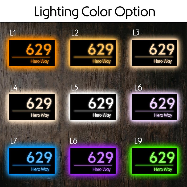 May include: A rectangular house number sign displaying the text 629 and Hero Way, presented in nine different LED lighting color options labeled L1 through L9, including orange, yellow, warm white, cool white, purple, blue, and green.
