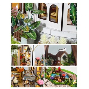 May include: A miniature dollhouse scene with a white exterior, arched windows, and detailed landscaping. The scene includes a small garden with plants, flowers, and a miniature pond. The overall aesthetic is charming and detailed.