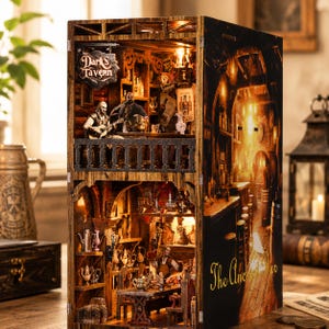 May include: A detailed wooden miniature tavern with interior lighting. The sign reads "Dark's Tavern". The interior features miniature figures, tables, shelves, and bar scenes. The side of the tavern reads "The Ancient Bar".