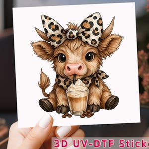 May include: A sticker featuring a cartoon calf with a bow and scarf in a leopard print design. The calf is drinking from a coffee cup with whipped cream. The sticker has the text "3D UV-DTF Sticker".