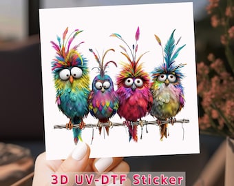 May include: A colorful sticker featuring four cartoon birds perched on a branch. Each bird has large eyes and vibrant plumage in shades of blue, yellow, pink, and purple. The text "3D UV-DTF Sticker" is at the bottom.