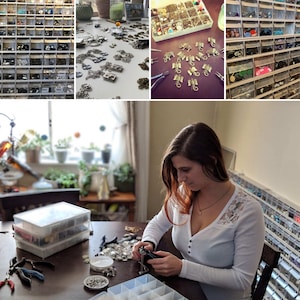 May include: A woman is working on a jewelry project at a table. She is using small tools to assemble jewelry pieces. There are many small containers filled with beads and other jewelry making supplies.
