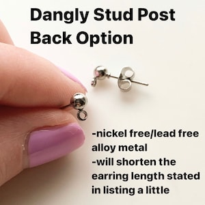 May include: Close-up of a pair of silver dangle earring posts. The posts are nickel and lead free. The text "Dangly Stud Post Back Option" is at the top of the image. The text "nickel free/lead free alloy metal" and "will shorten the earring length stated in listing a little" is at the bottom of the image.