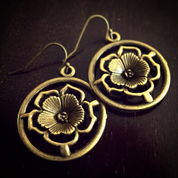 Items similar to Lotus Flower Disk Earrings / Antique
