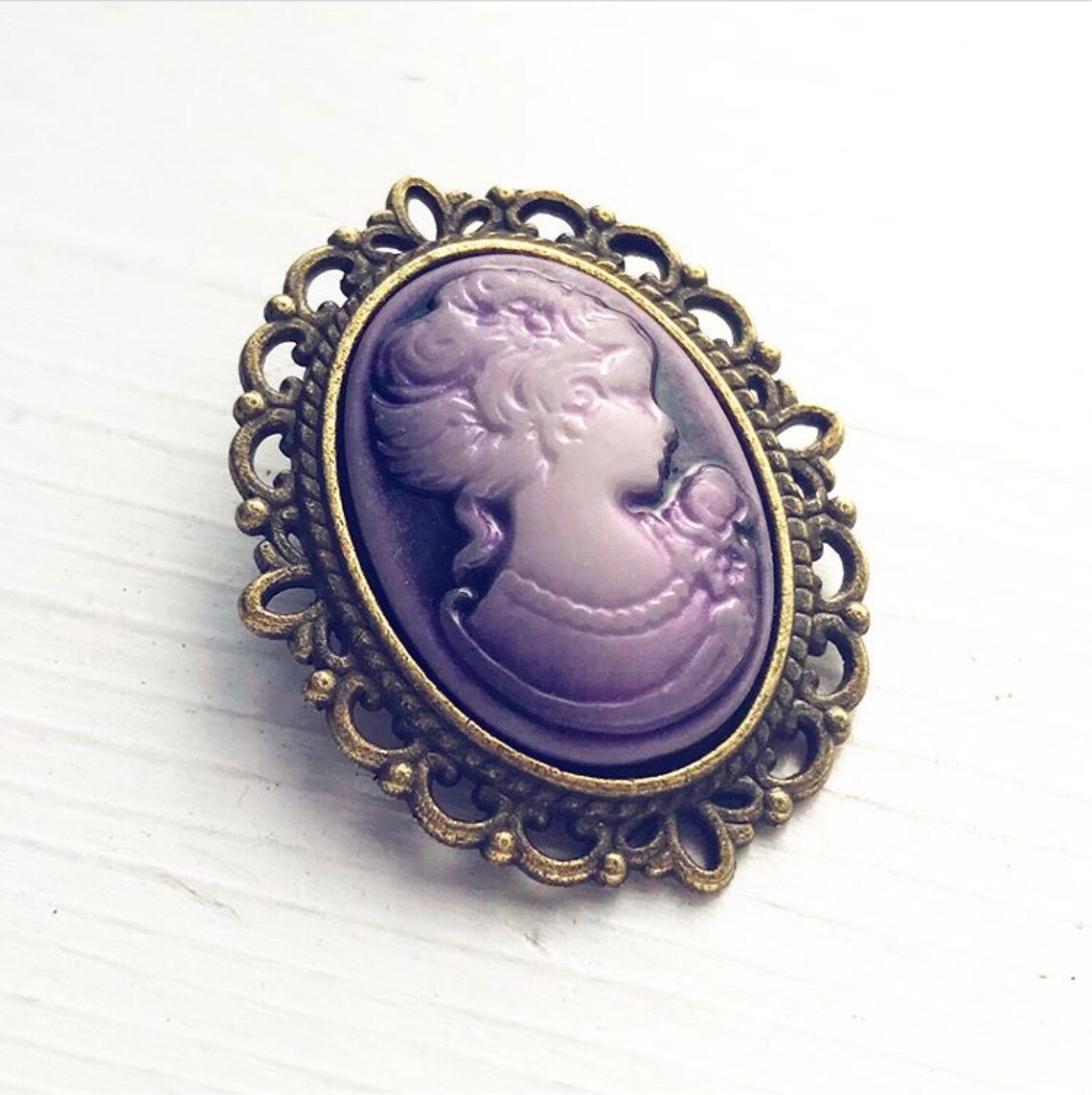 purple cameo brooch