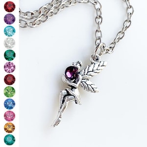 May include: A silver fairy charm necklace with a purple crystal. The fairy is holding the crystal in her hands and has wings.