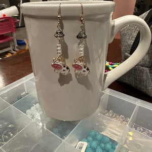 UFO cow earrings