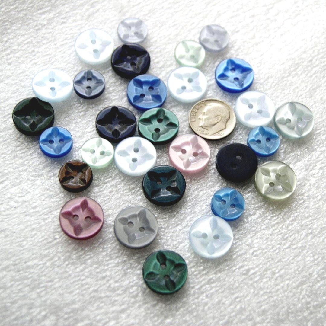 29 Blue and Pink Pressed Embossed Buttons, 1/2