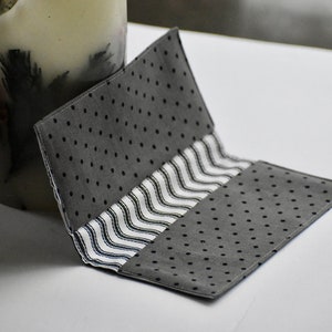 Checkbook cover - Polkadots in black and grey, white and black stripes inside