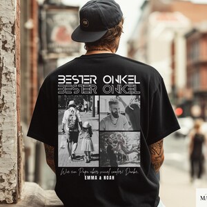 May include: Black t-shirt with the text "BESTER ONKEL" in white, above four black and white photos. The shirt also has text at the bottom, including "EMMA & NOAH". The person in the image is wearing a black cap.