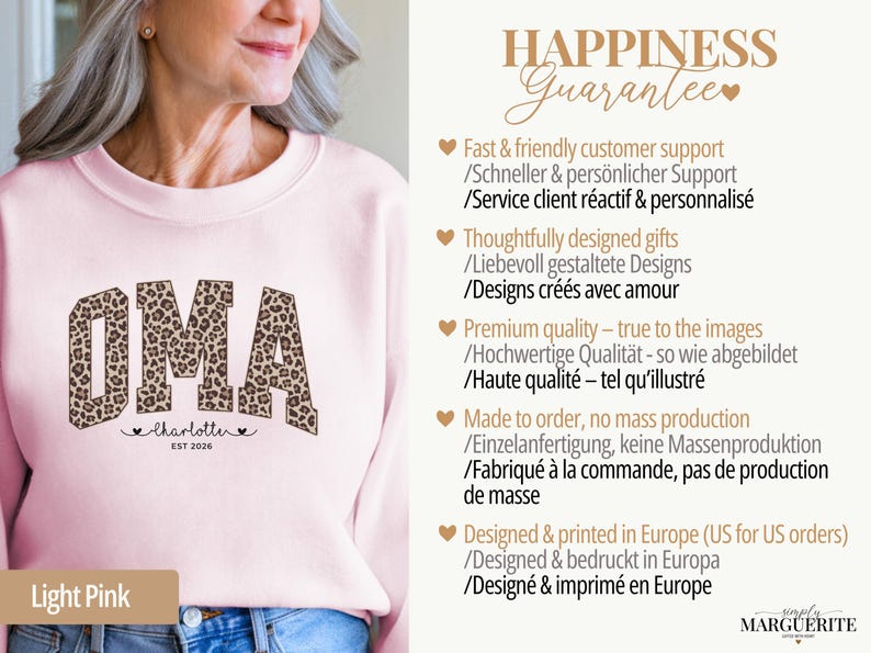 May include: Light pink sweatshirt with the word "OMA" in a leopard print design. Below the word "OMA" is the name "Charlotte" and the year "EST 2026". The sweatshirt is part of a gift collection.