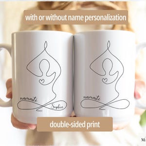 May include: Two white ceramic mugs with a black line drawing of a person in a yoga pose, a heart, and the word "namaste". One mug has the name "Sophie" below the word "namaste". The mugs have the text "with or without name personalization" and "double-sided print".