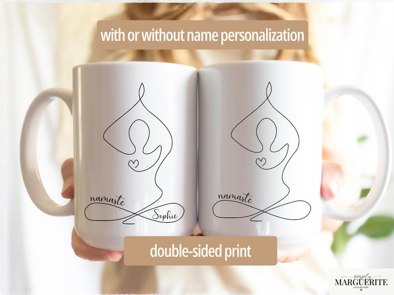 May include: Two white ceramic mugs with a black line drawing of a person in a yoga pose, a heart, and the word "namaste". One mug has the name "Sophie" below the word "namaste". The mugs have the text "with or without name personalization" and "double-sided print".