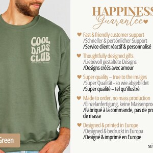 May include: Military green sweatshirt with the text "COOL DADS CLUB" in a retro font. The sweatshirt is a solid color and has a crew neck. The text "MOM & LEO - EST. 2022" is below the main text.