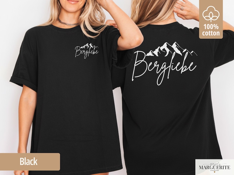 May include: Black t-shirt with the word "Bergliebe" and a mountain range graphic in white on the front and back. The shirt is made of 100% cotton.