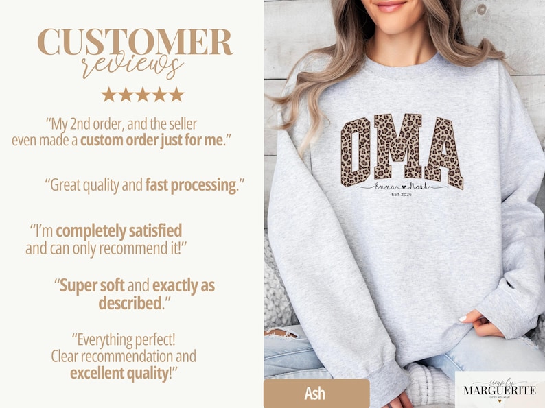 May include: A light gray sweatshirt featuring the word "OMA" in a leopard print design. Below the word "OMA" is the text "Emma & Noah" and "EST 2020". The sweatshirt also has customer reviews on the left side.