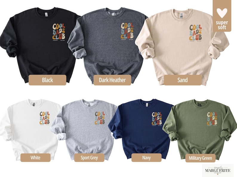 May include: A selection of crewneck sweatshirts in various colors, including black, dark heather, sand, white, sport grey, navy, and military green. Each sweatshirt features the text "COOL DADS CLUB" in a retro font on the chest.