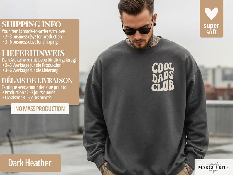 May include: Dark heather gray sweatshirt with the text "COOL DADS CLUB" in a white, retro font. The sweatshirt is made of a soft material. The image also includes the text "super soft".