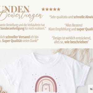 May include: A white t-shirt featuring a muted rainbow graphic with the name Lena and a small heart. The image includes five-star ratings and German customer reviews stating: Sehr qualitativ und schnelle Abwicklung, Alles Bestens, and more.