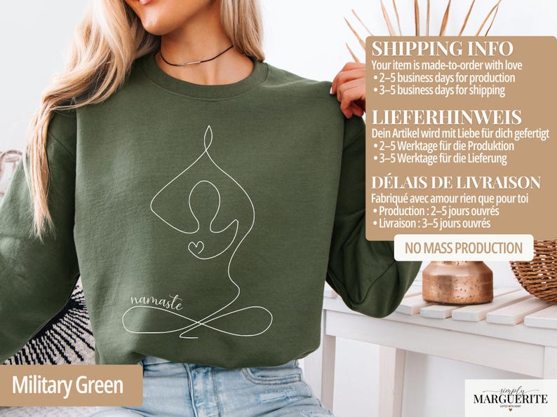 May include: Military green sweatshirt with a white line drawing of a yoga pose and the word "namaste". The sweatshirt is made of a soft material and is perfect for yoga enthusiasts.