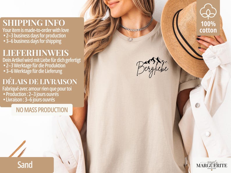 May include: Sand-colored t-shirt with the word "Bergfiebe" and a mountain graphic in black. The shirt is made of 100% cotton. A straw hat is visible in the background. The shirt is from the brand "simply MARGUERITE".