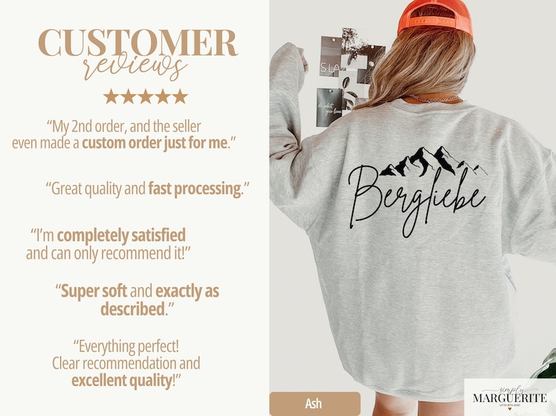 May include: Light grey sweatshirt with a black mountain graphic and the word "Bergfliebe". The sweatshirt is ash-colored and has customer reviews on the left side. The brand name "simply MARGUERITE" is at the bottom right.