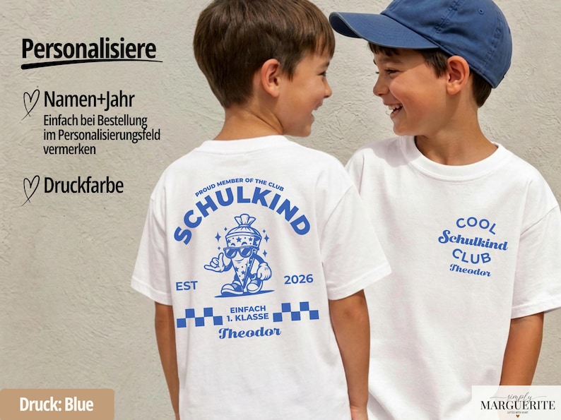 May include: A white t-shirt featuring blue graphics. The back displays a cartoon school cone character wearing sunglasses with the text SCHULKIND, EST 2026, and EINFACH 1. KLASSE. The front left chest features the text COOL SCHULKIND CLUB and Theodor.
