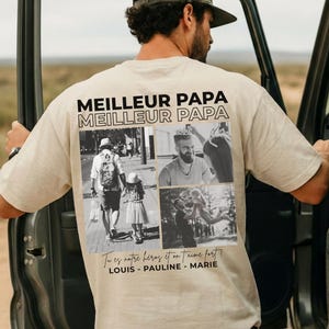 K&ouml;nnte beinhalten: Beiges T-Shirt mit der Aufschrift "MEILLEUR PAPA" und einer Collage aus Schwarz-Wei&szlig;-Fotos. Das Shirt tr&auml;gt auch den Text "Tu es notre h&eacute;ros et on t'aime fort!" und die Namen LOUIS, PAULINE und MARIE.
