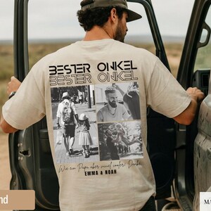 May include: A sand-colored t-shirt with the words "BESTER ONKEL" printed on the back, along with a collage of black and white photos. The shirt also features text in German and the names "EMMA & NOAH".