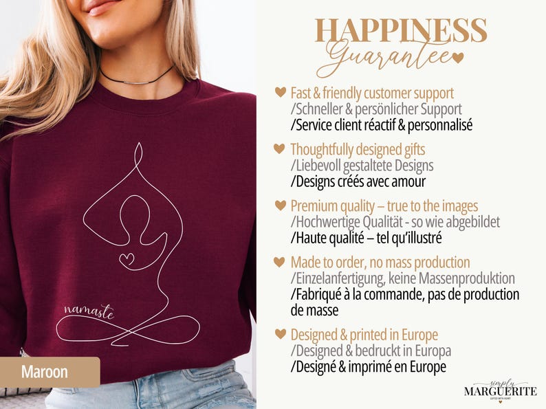 May include: Maroon sweatshirt with a white line drawing of a person in a yoga pose, with the word "namaste" in script. The sweatshirt has a crew neck and is made of a soft material. The text "HAPPINESS Guarantee" is in the background.