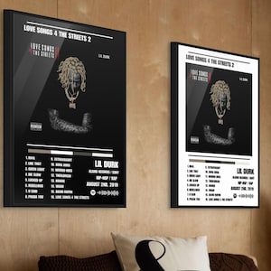 May include: Two framed posters of Lil Durk's album "Love Songs 4 The Streets 2". The posters feature a black background with the album title and tracklist. The album cover art features a portrait of Lil Durk.