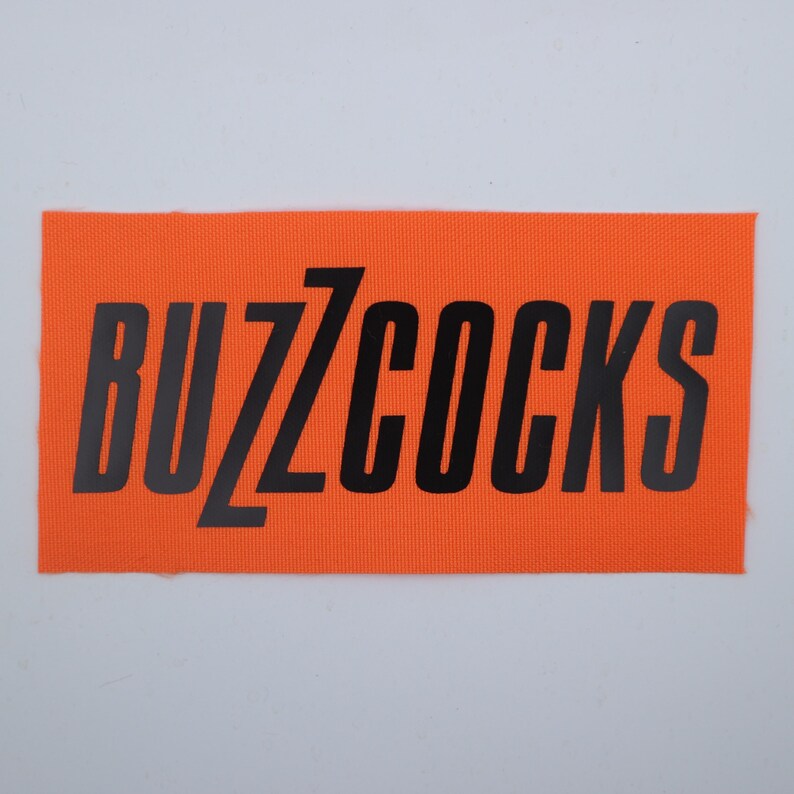 Buzzcocks - Logo Patch Orange/Black