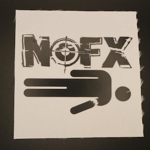 May include: White square patch with a black graphic. The graphic features the word "NOFX" above a target symbol and a stylized figure. The patch has a raw edge.