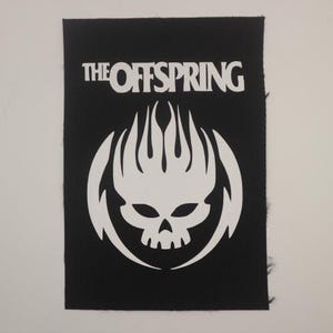 May include: Black and white embroidered patch with the band name "The Offspring" and a skull with flames design.