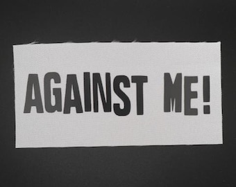 Contra mí - Parche con el logotipo