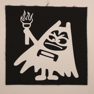 May include: A white cartoon character patch with a torch, set against a black background. The character has an angry expression and is holding a torch aloft. The patch is square and has a textured appearance.