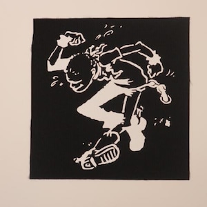 May include: Black and white patch featuring a stylized silhouette of a person jumping in the air with their arms raised.