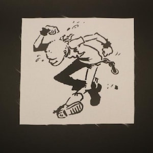 May include: Black and white stencil art of a person running, with one shoe falling off. The figure is wearing a shirt, pants, and gloves. The artwork is on a white square fabric.