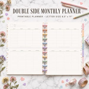 May include: A double side monthly planner with a white grid layout, featuring the text DOUBLE SIDE MONTHLY PLANNER PRINTABLE PLANNER LETTER SIZE 8.5" x 11". The planner has a central disc-bound spine with colorful discs and floral accents.