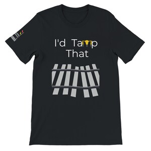 May include: Black t-shirt with the text "I'd Tamp That" and a graphic of railway tracks. The text is in white and the tracks are grey.