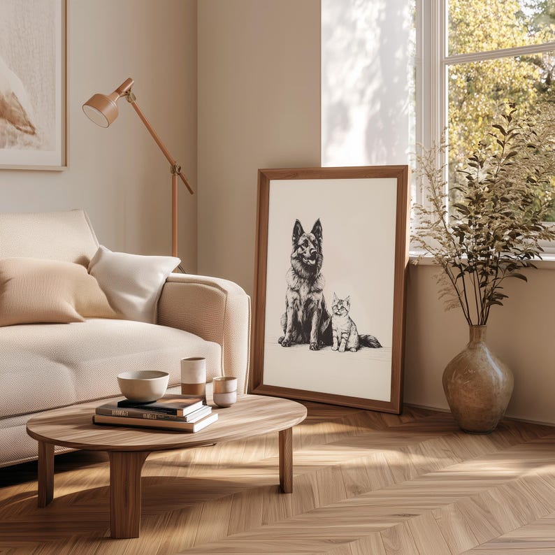 May include: A black and white illustration of a German Shepherd dog and a cat sitting side by side. The illustration is framed and hanging on a wall in a living room.