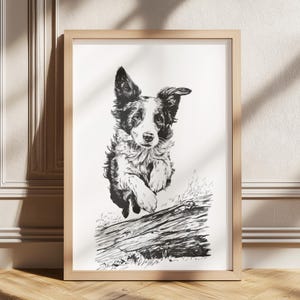 Könnte beinhalten: Ein gerahmter Schwarz-Weiß-Druck eines Border Collie-Hundes, der über einen Baumstamm springt. Der Hund wird in der Luft dargestellt, mit aufgestellten Ohren und ausgestreckten Pfoten. Das Kunstwerk ist im minimalistischen Stil gehalten.