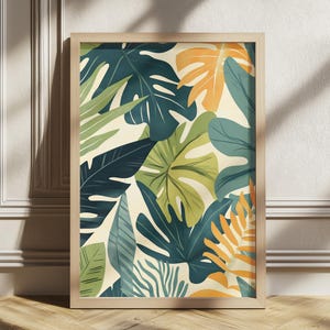 May include: A framed botanical print featuring a vibrant arrangement of tropical leaves in shades of green, blue, and orange against a cream background. The artwork is encased in a light-colored wooden frame, suitable for wall decor.