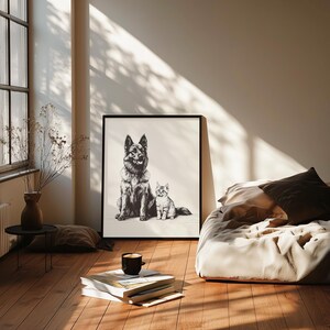 May include: Black and white illustration of a German Shepherd dog and a cat sitting side by side. The image is framed and hanging on a wall in a room with a bed and a window.