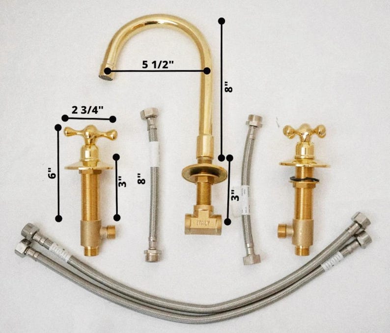 May include: A new gold-colored bathroom faucet set with a gooseneck spout, two cross-handle valves, and flexible supply lines. The faucet is 5 1/2 inches wide and 8 inches tall. The valves are 6 inches tall and 2 3/4 inches wide.