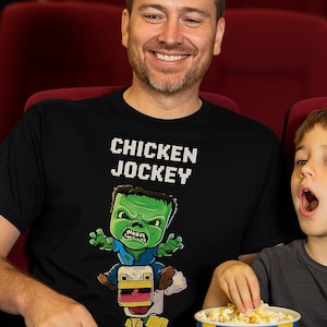 Chicken Jockey T-Shirt for Kids and Adults Crew Neck Short Sleeve Fun Gamer Tee