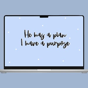 May include: A light blue laptop screen with white dots and the text "He has a plan. I have a purpose." in black cursive font.